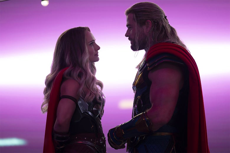 A man and woman clad in Thor costumes stare into each other's eyes.