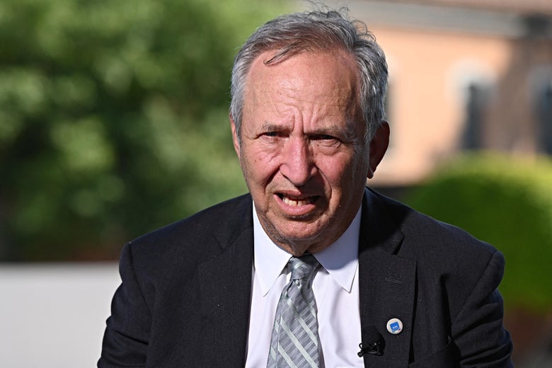 Larry Summers, outdoors looking at the camera as he speaks.